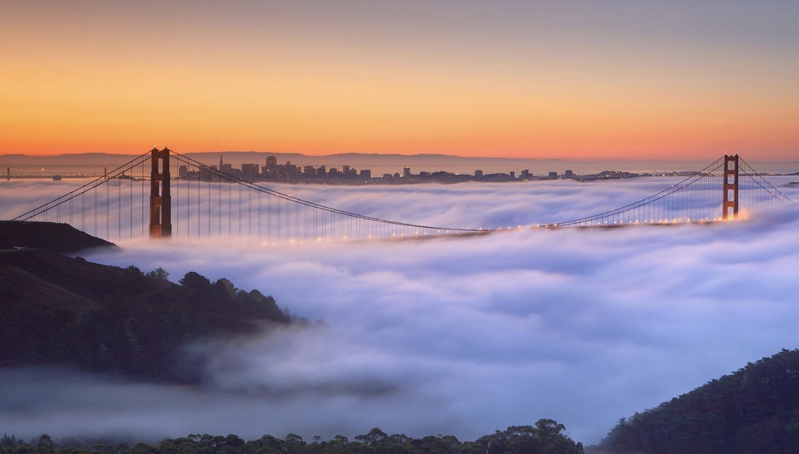 The Golden Gate Bridge rising above the fog, Marin County, California